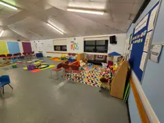 The soft seating and play corner in the Upstairs Back Hall