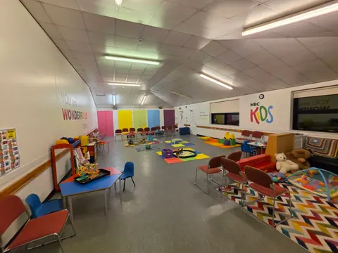 The Upstairs Back Hall with play stations and chairs