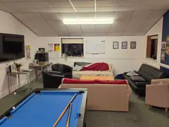 The Youth Room's seating area and wall-mounted screen