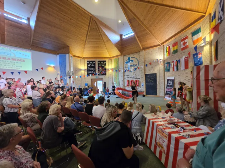 A large audience watching a circus performance during the Vintage Fayre.