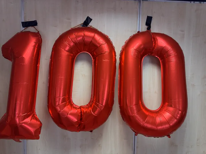 Large red balloons forming the number 100 at the Vintage Fayre.
