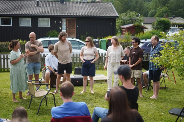 A group gathered outdoors for a summer celebration.