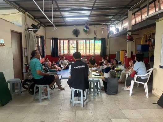 The Hope Home team gathered around a table for training.